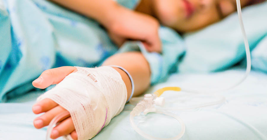 Child receiving fluids in hospital