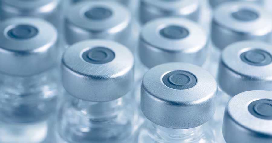 Rows of glass medicine vials.