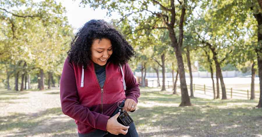 Woman checking insulin pump