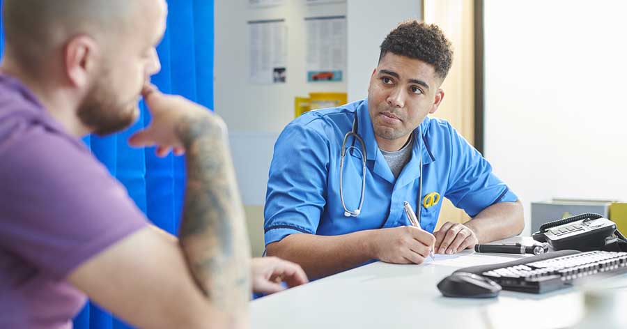 Nurse in consultation with patient