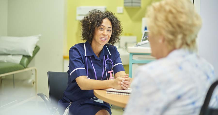 Nurse in consultation with patient