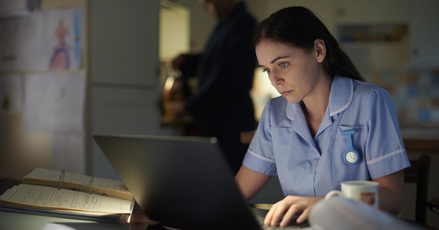 Nurse studying at home