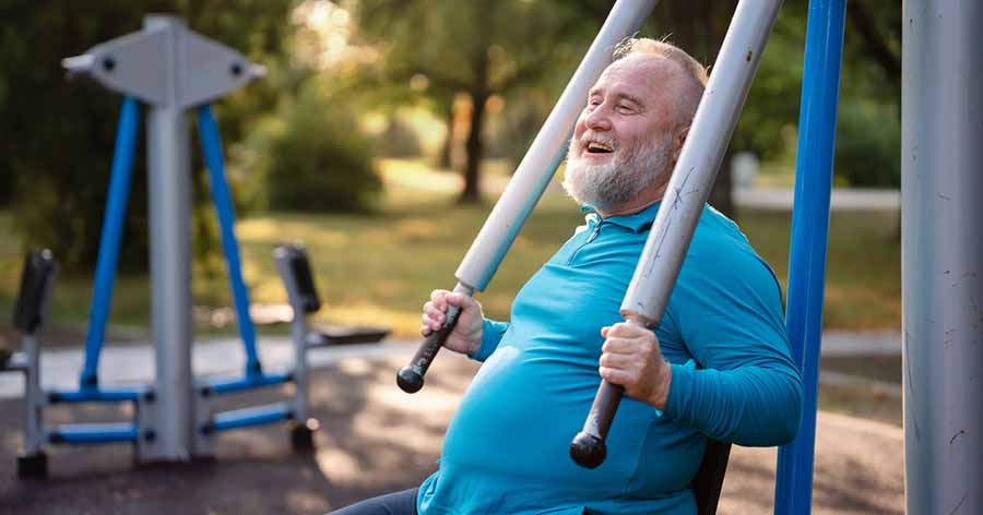 Overweight man exercising in park